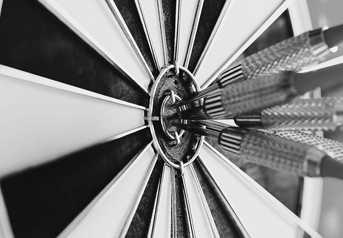 Dart on a board symbolising company vision and mission